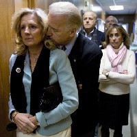 Jill Biden in black pashmina muffler. But check out her tangerine!