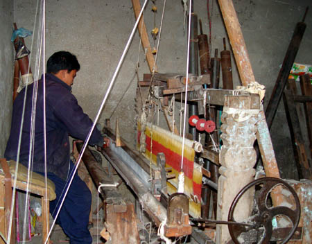 Sudhip cleaning his loom.