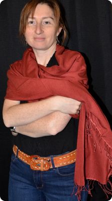 Empar is wearing a medium size Ama Dablam shawl in Marsala (#ADmt-180D)