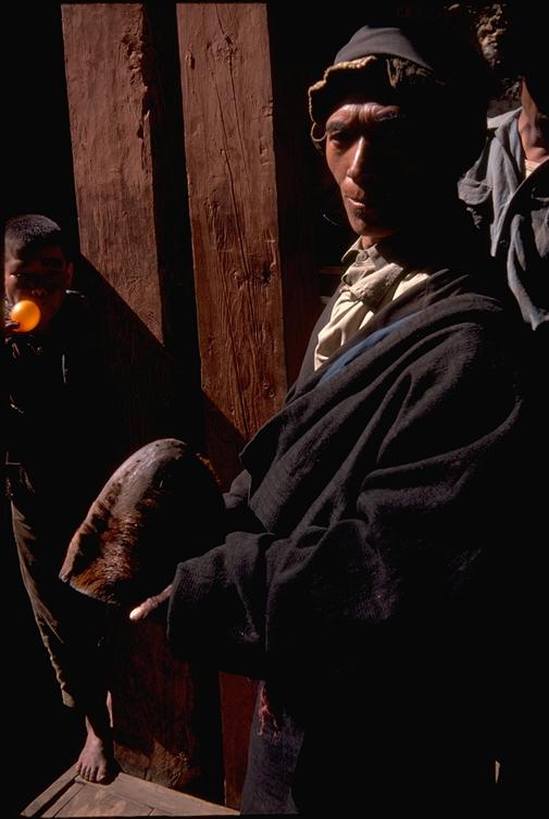 Monk at Pangboche gompa, holding so-called yeti scalp